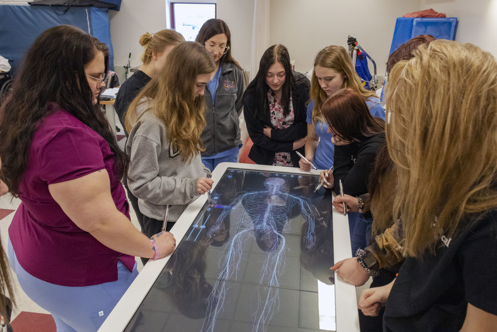 Health Care Careers students study human anatomy on the Anatomage Table, a fully segmented real human 3D anatomy system.